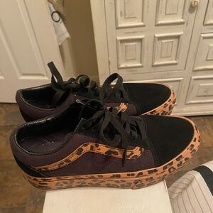 Black cheetah print vans.